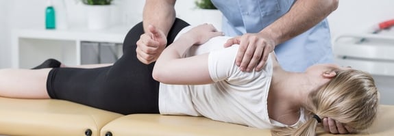 Chiropractor adjusting the Lumbar Region for a subluxation